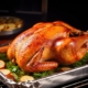 Roast Turkey with the trimmings with a dark background on a metal roasting tin
